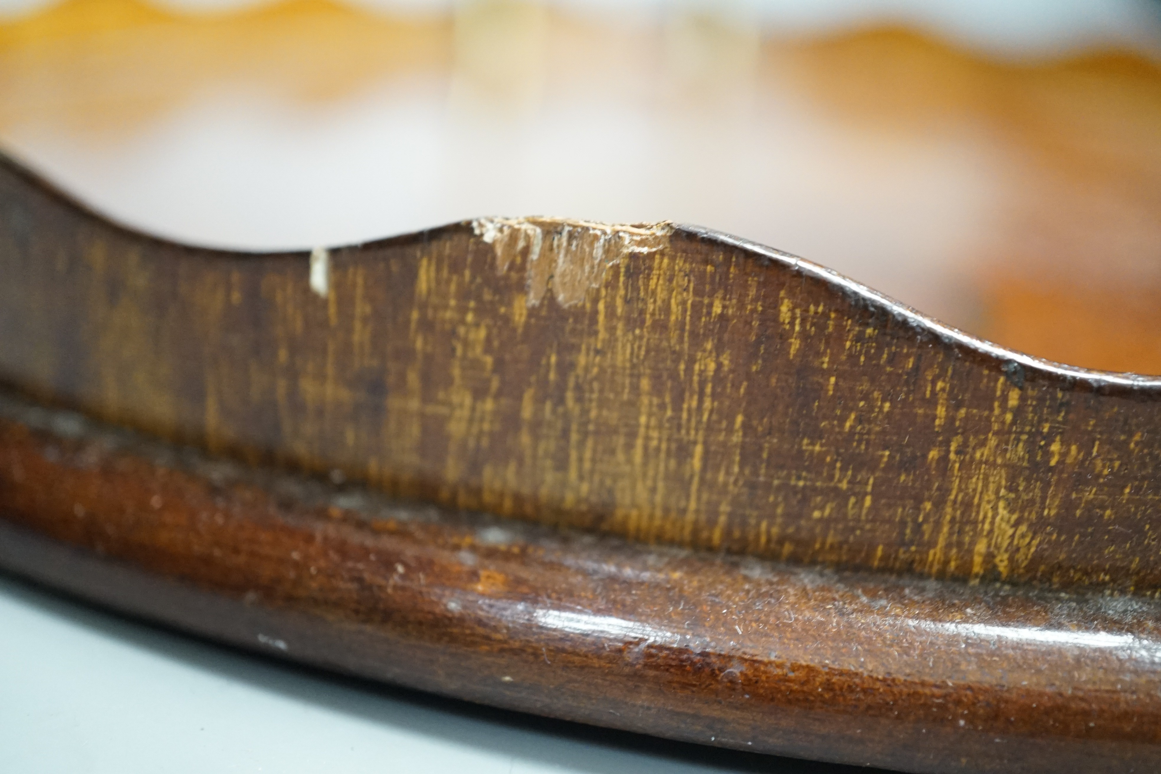 A circular shell inlaid, pie crust edged, brass handled, mahogany tray, 34.5 cms diameter